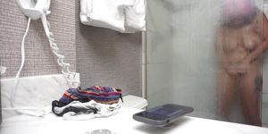 Hidden camera in hotel bathroom filming a hot slut as she showers