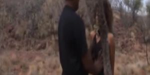 African slave gets abused by masters outdoors