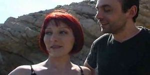 Cute redhead stripped on beach  FM14