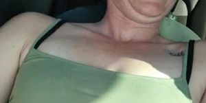 Sexy slut plays with pussy while driving around town