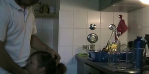 Couple having sex in kitchen