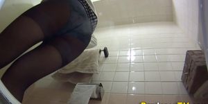 Asian slut pees in toilet - video 1