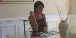 Woman Smokes in Dining Room