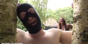 Mistress in latex ties slave to tree and whips him before suck and screw bbc
