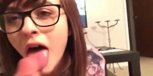 Brunette cute girl with glasses gives a nice blowjob