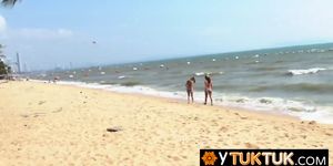 Two Thai cute whores found on the beach decide to please and satisfy a big white traveler cock