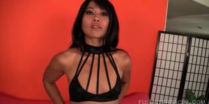 Hot Asian slut tips aside strings and rubs clit