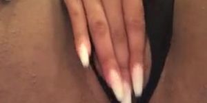 Sexy ebony with long nails playing on camera