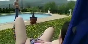 Nasty slut ramming a stud ass by the poolside with a strapon