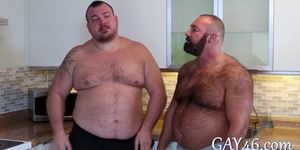 Two fat guys with sexy bellies fucking in the kitchen