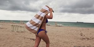 Latina in bikini on the beach has fun (Maya Bijou)