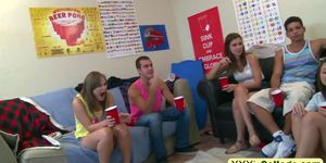 A dirty brunette college slut takes on two hard cocks in a dorm room