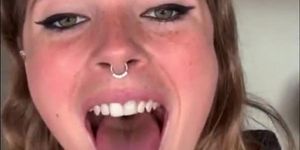 Beautiful face and tongue out girl with nose ring