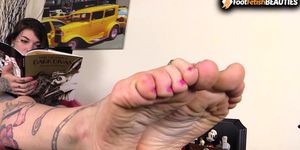 Barefoot Redhead massages her feet and toes in your face