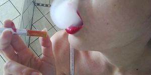 SMOKING ND SUCKING CIGARETTE IN RED LIPS