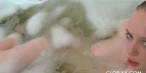 Gloria washing her delicate naked body in bathtub