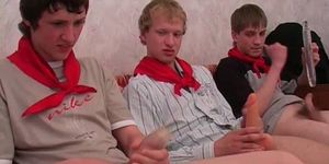 Three teen boys playing with toys