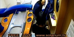 Two Hot Horns Girls in the tanning Salon together on the solarium, they masturbate together filmed Live Voyeur Hidden Cam