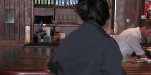 Business woman strips for bartender on the bar