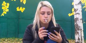 Gorgeous young blonde smoking sexy