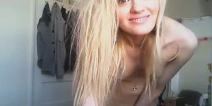 Pint sized blonde babe fingers herself on web cam