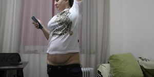 Fat Blonde Bitch Sags Her Pants While Folding Laundry and Stretches