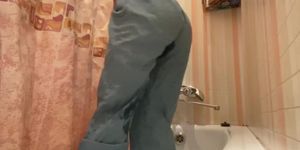Girl with cool ass pee in jeans, play with shower and play with pussy until she cum