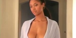Tyra Moore feels her breasts