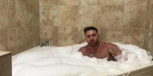 Handsome aesthetic bodybuilder with short cock flex his muscles in bathroom