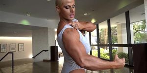 Huge Blonde FBB Pumps Biceps
