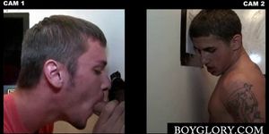 Tattooed stud gets gay blown on gloryhole