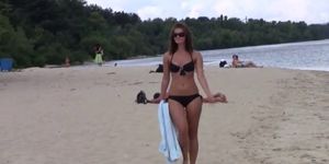 This teen nudist strips bare at a public beach - video 1