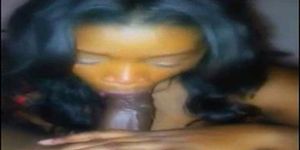 Cute black woman with the cock in the mouth