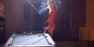 Gorgeous blonde Cougar smoking while shooting pool