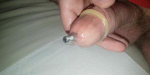 Urethral Sounding a rod while wearing a condom, sounding cumshot inside a condom with cockring