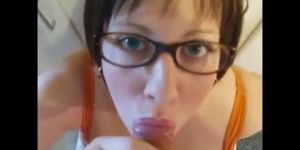 Short hair BBW with glasses and big tits takes huge facial