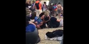 wasted girl at a festival goes crazy