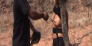 African slave made into pleasing cocks outdoors