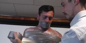 Sexy Hunk Hogtied and Jockstrap Gagged Before Being Wrapped in Duct Tape