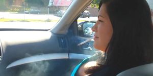 Busty Latina girl Christina smoking sexy in car