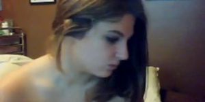 Bored brunette on webcam.