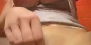 Horny babe fingering in the toilet - video 1