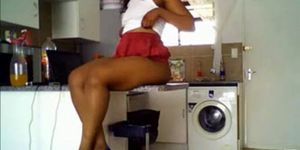 Sexy ebony girl with juicy ass teasing in kitchen