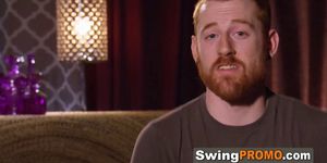 Redhead swinger sucks big cock at orgy