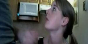 Young wife gives head in the kitchen