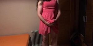 Sissy in pink dress strokes her cock with cumshot on face