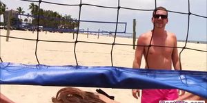 Lovely ladies play two kinds of balls on the beach