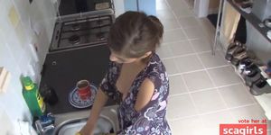 beauty exposed in down blouse while doing the dishes - video 1
