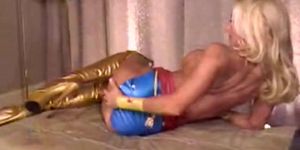 Blonde latex wonder woman stripping and teasing the hell out of the viewer, no sex