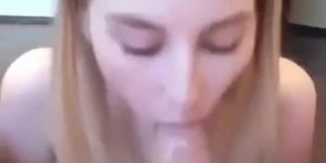 Young amateur giggling while giving head